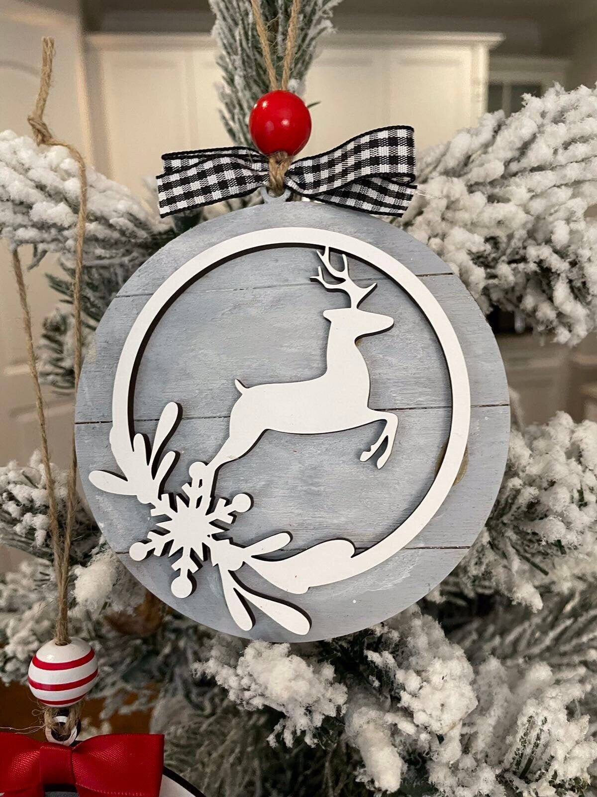 Farmhouse style Christmas ornament with deer on shiplap background