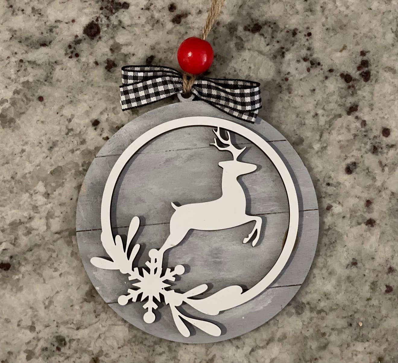 Farmhouse style Christmas ornament with deer on shiplap background