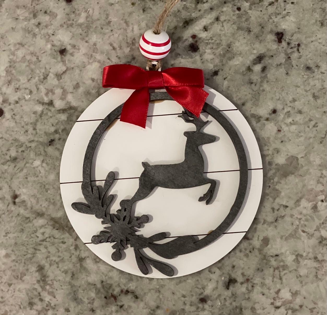 Farmhouse style Christmas ornament with deer on shiplap background