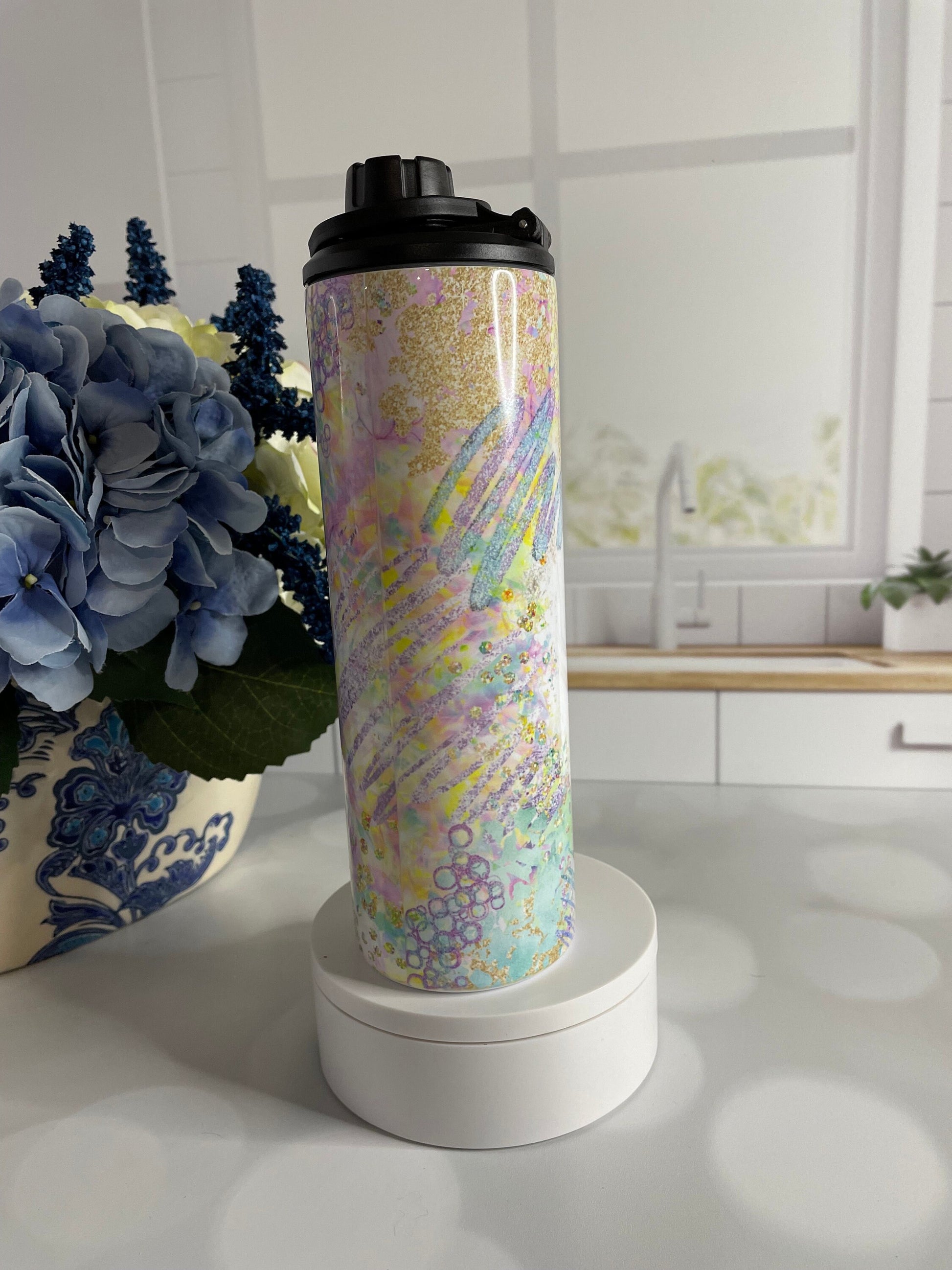 Stainless steel tumbler/ water bottle featuring pastel colors and coffee and chaos theme
