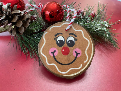 Gingerbread boy and girl ornaments on live edge wood slices