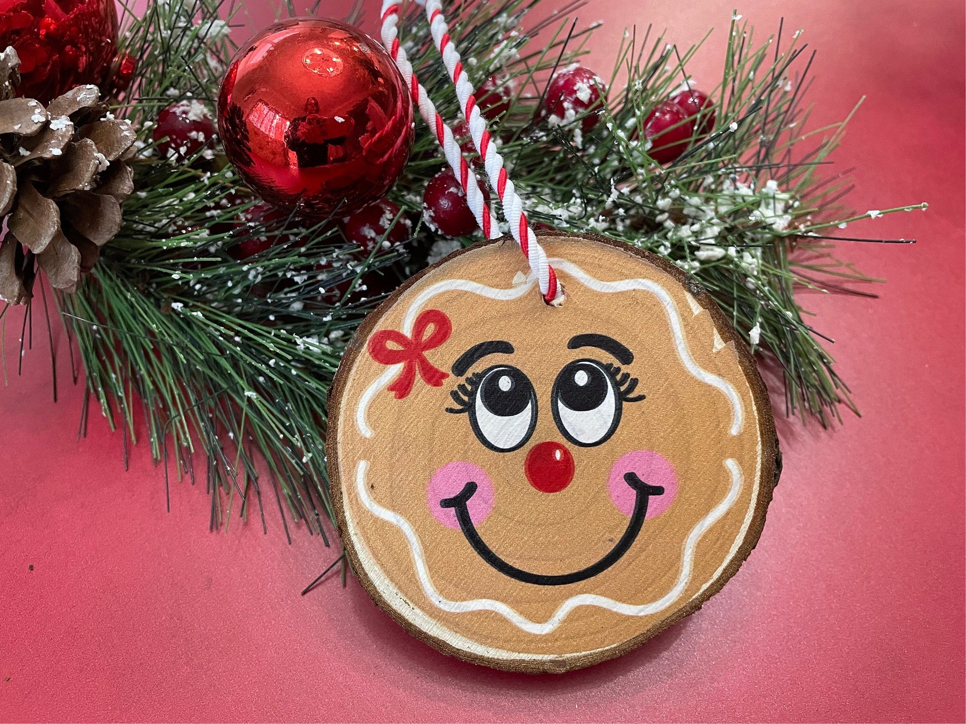 Gingerbread boy and girl ornaments on live edge wood slices